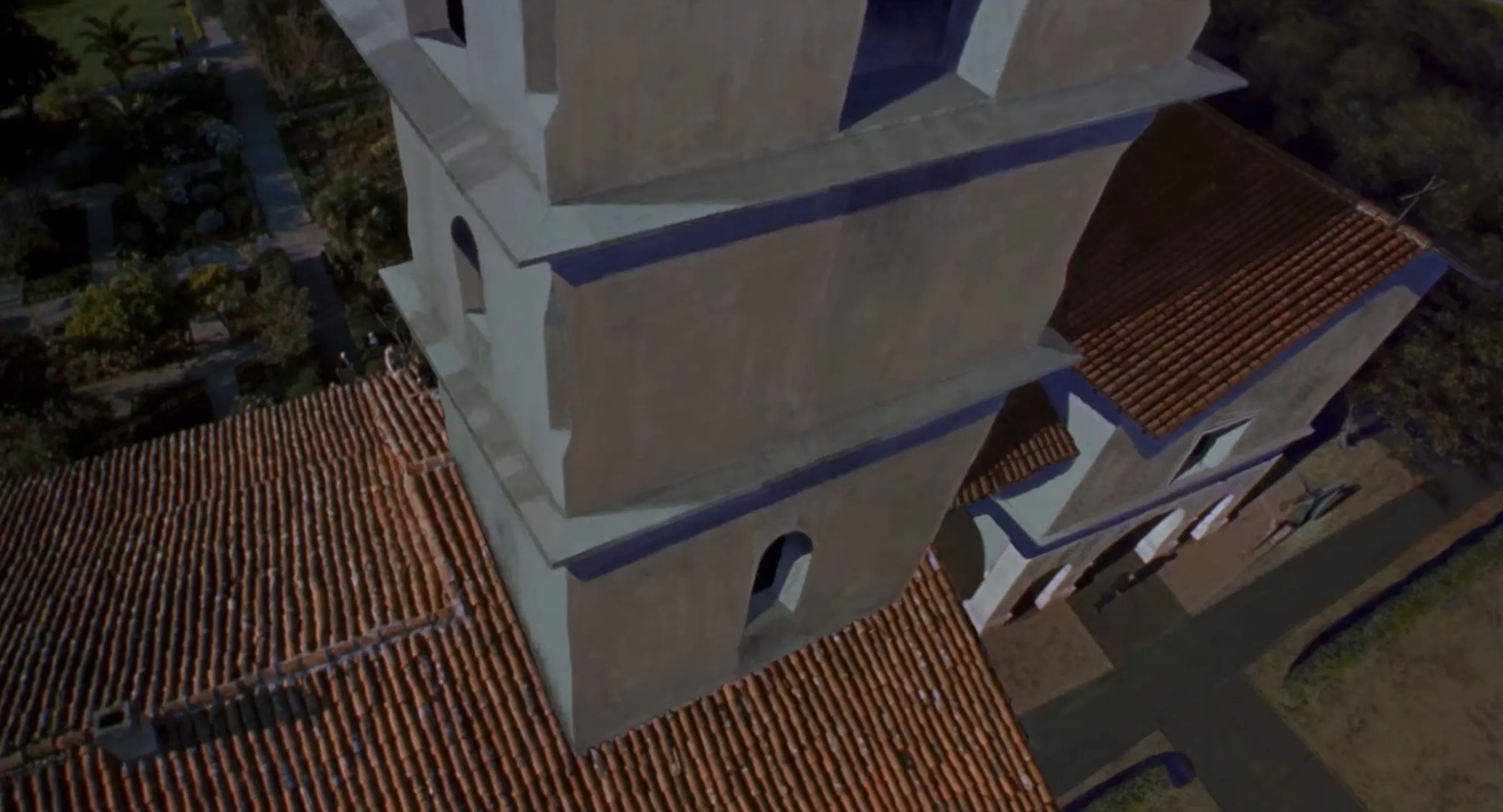 My favorite scene from the movie. A dizzying top-down shot of a tall mission-style bell tower and red-tiled roof.